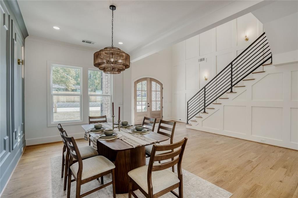 936 Cooper Road Loganville, GA 30052 - Photo 11 of 34 a view of a dining room with furniture window and wooden floor