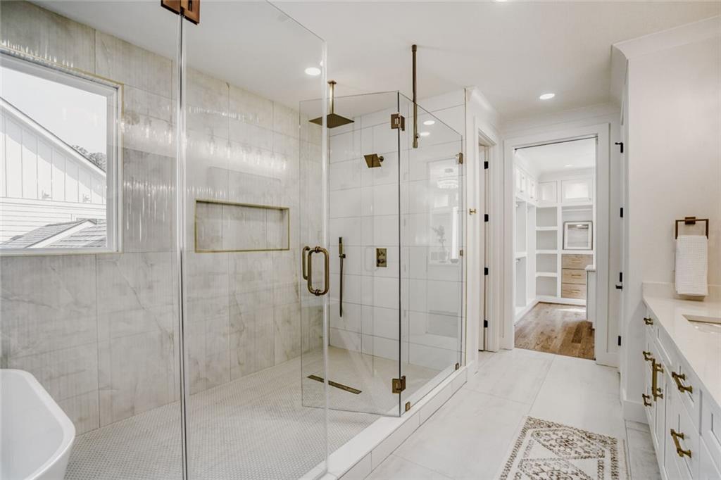 936 Cooper Road Loganville, GA 30052 - Photo 20 of 34 a bathroom with a shower and a sink