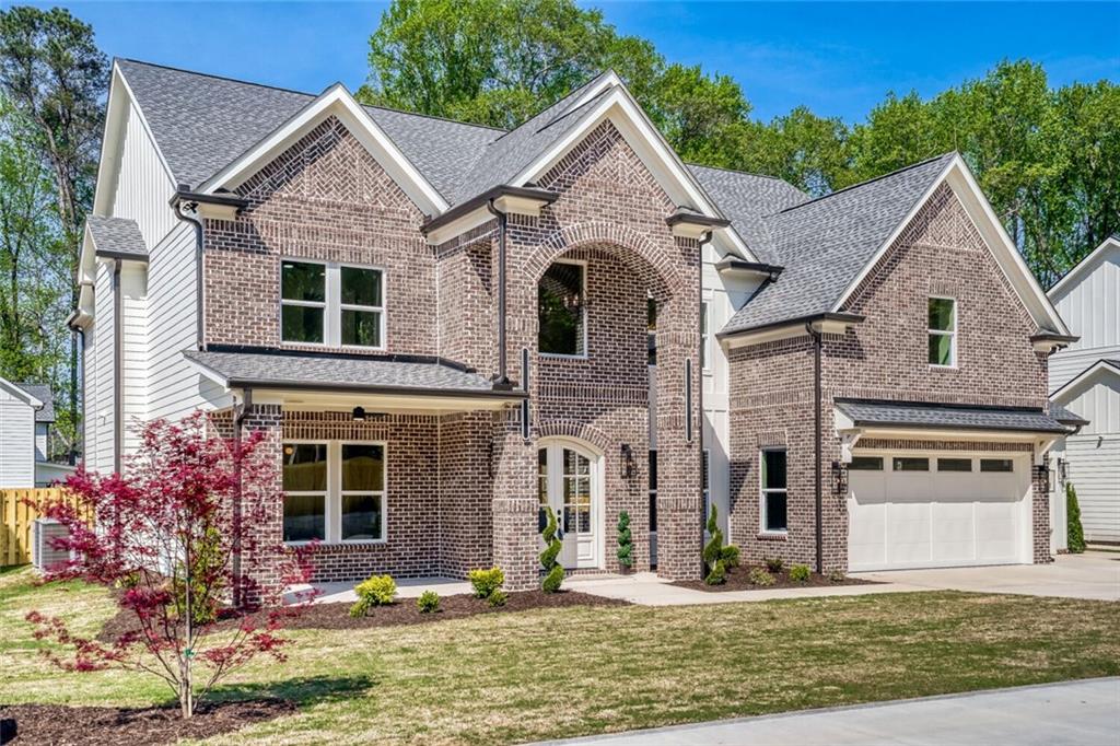 936 Cooper Road Loganville, GA 30052 - Photo 2 of 34 front view of a house with a yard