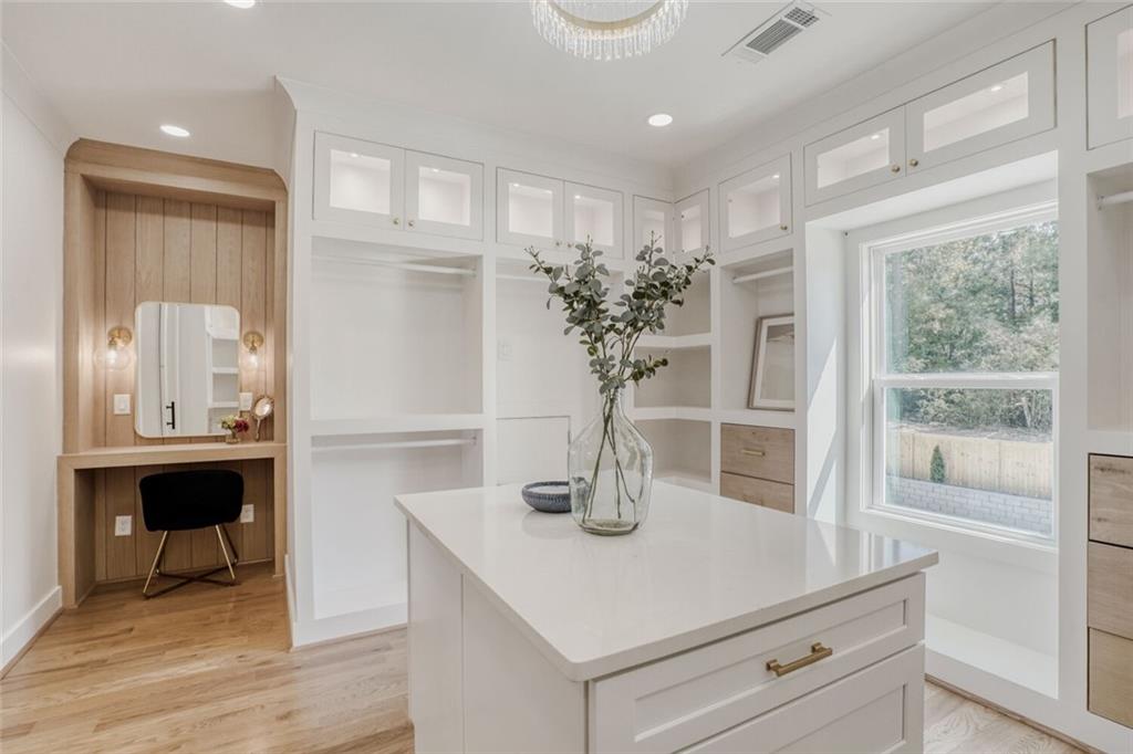 936 Cooper Road Loganville, GA 30052 - Photo 21 of 34 a kitchen with a refrigerator a sink and cabinets