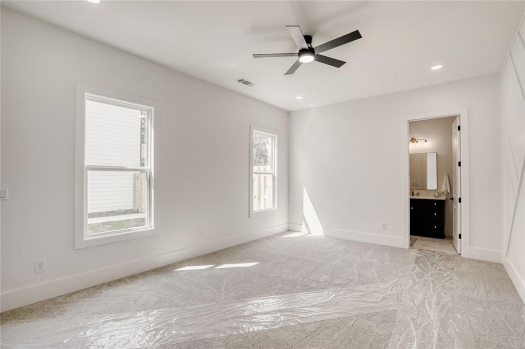 936 Cooper Road Loganville, GA 30052 - Photo 22 of 34 a view of an empty room with a window