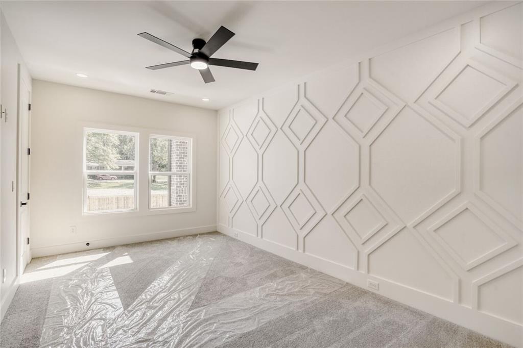 936 Cooper Road Loganville, GA 30052 - Photo 24 of 34 a view of an empty room with a window