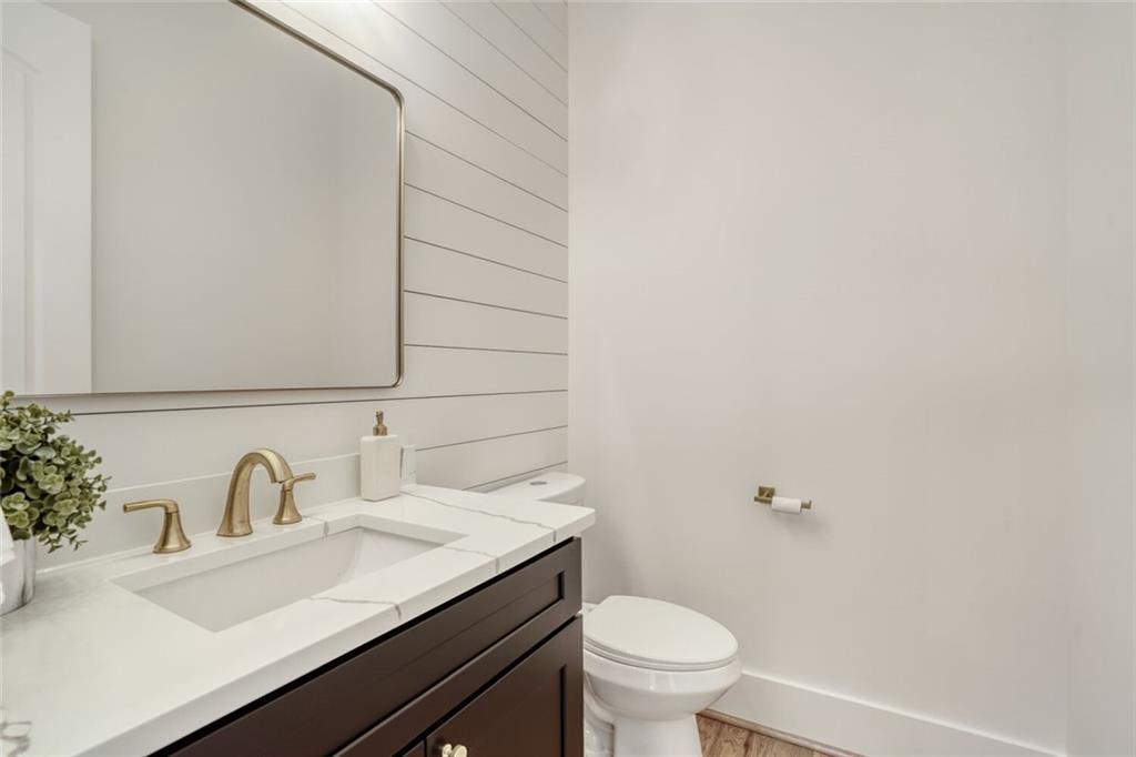 936 Cooper Road Loganville, GA 30052 - Photo 29 of 34 a bathroom with a sink and a toilet