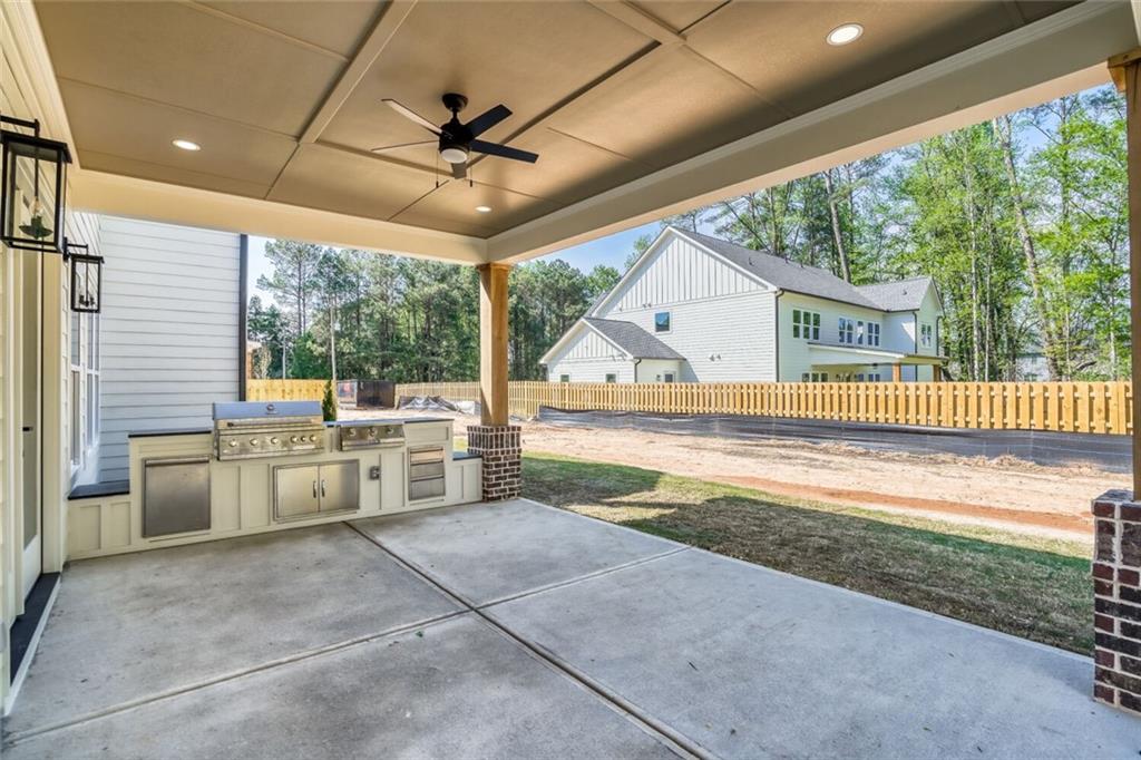 936 Cooper Road Loganville, GA 30052 - Photo 34 of 34 a view of a porch with furniture and a backyard