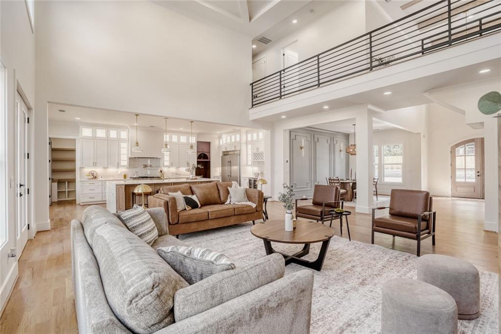 936 Cooper Road Loganville, GA 30052 - Photo 7 of 34 a living room with furniture or kitchen view and a wooden floor