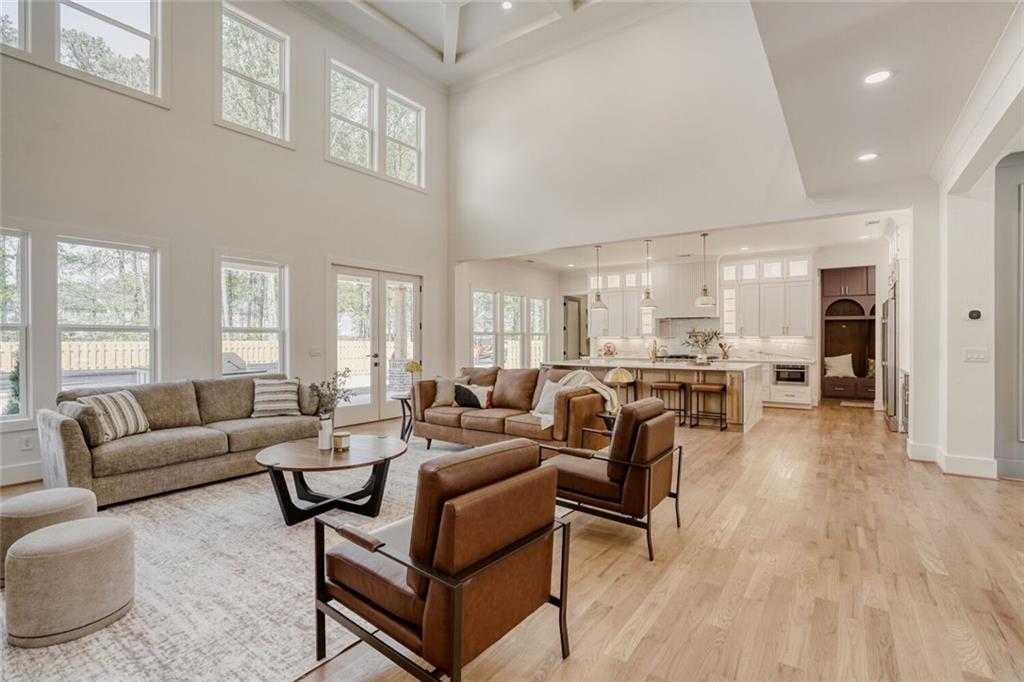 936 Cooper Road Loganville, GA 30052 - Photo 8 of 34 a living room with furniture and a large window