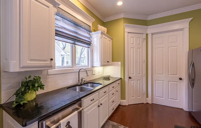 a kitchen that has a sink and a window in it