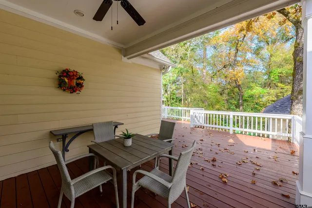 a view of a balcony with a table and chair