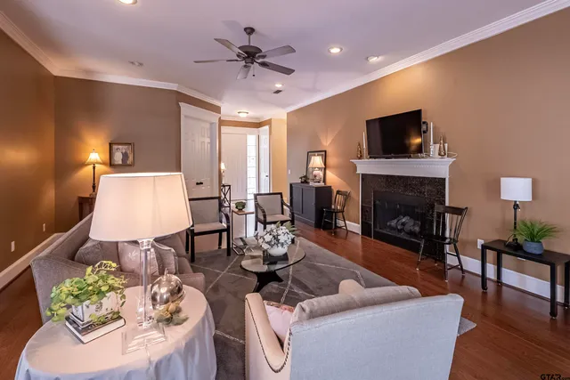 a living room with furniture and a fireplace