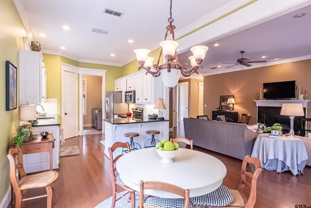 a living room with fireplace furniture and a flat screen tv