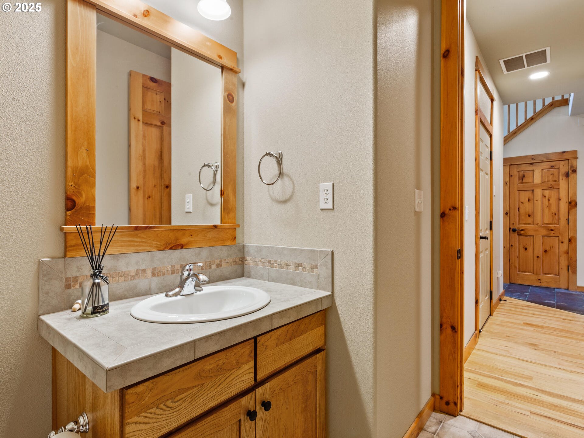 12800 Northeast Salmon Creek Avenue, Unit 119 Vancouver, WA 98686 - Photo 17 of 46 a bathroom with a sink a mirror and a shower
