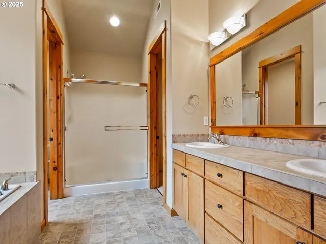 a view of a bathroom with a tub and a window