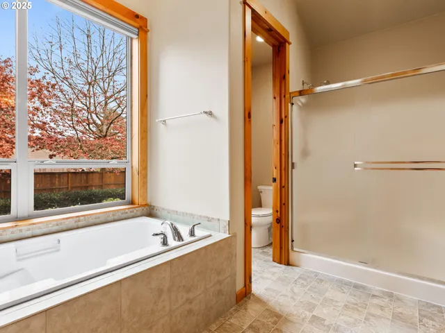a bath tub sitting next to a window