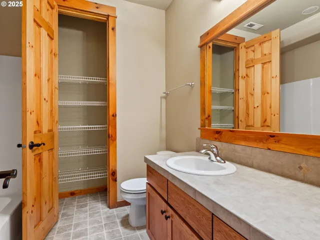 a view of a garden with a tree in the background