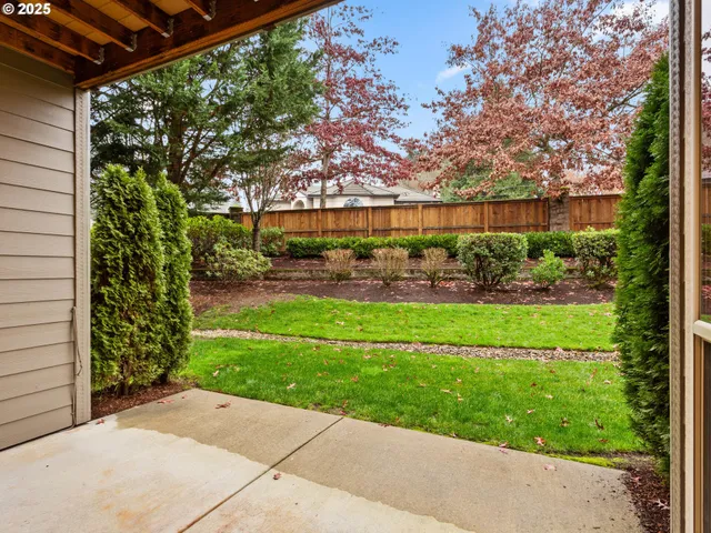 a backyard of a house with lots of green space