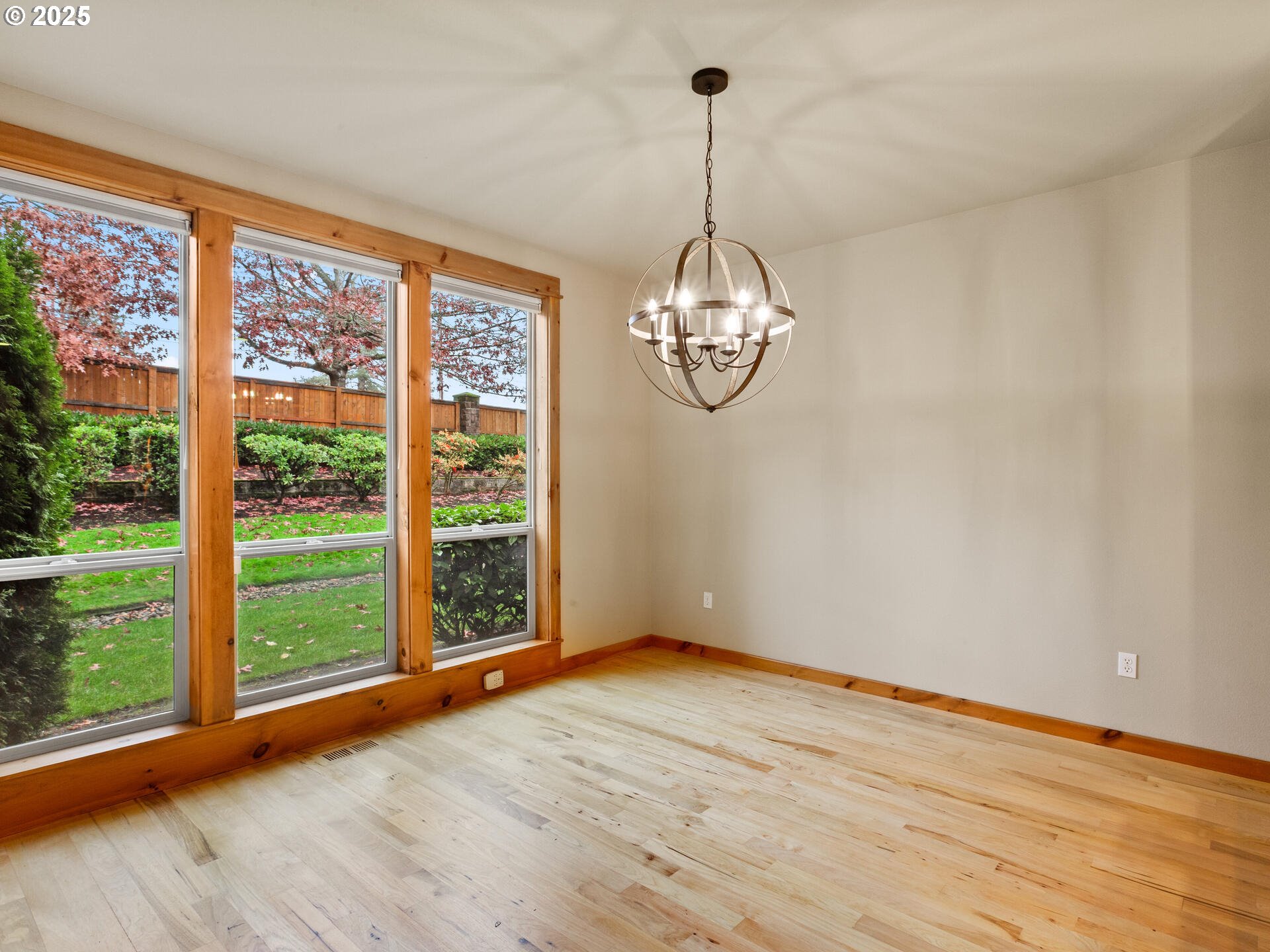 12800 Northeast Salmon Creek Avenue, Unit 119 Vancouver, WA 98686 - Photo 7 of 46 a view of empty room with wooden floor and fan