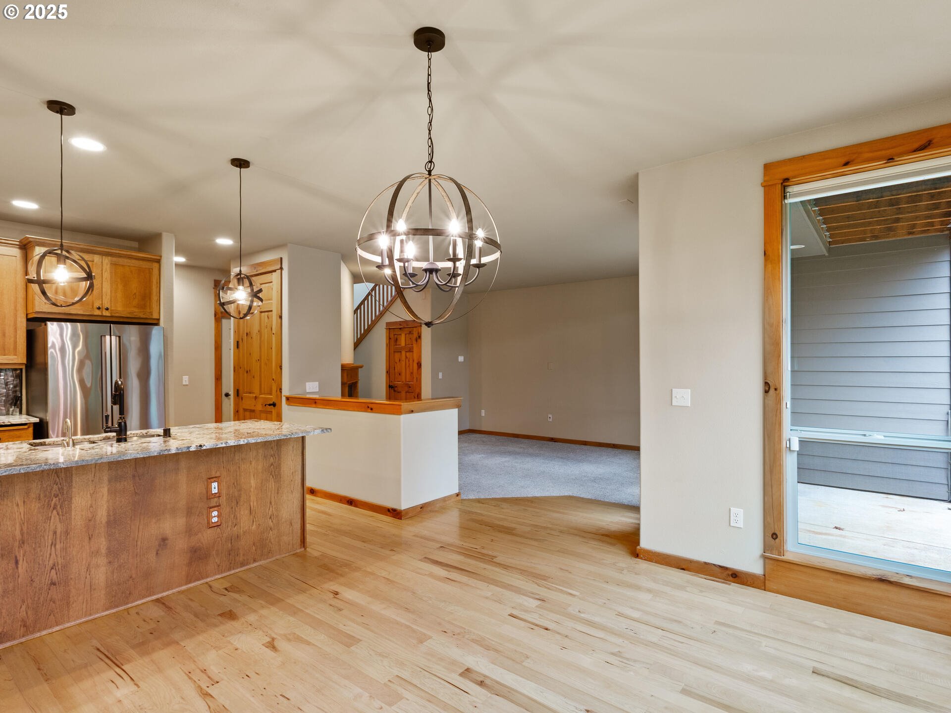 12800 Northeast Salmon Creek Avenue, Unit 119 Vancouver, WA 98686 - Photo 9 of 46 a view of a kitchen with kitchen island stainless steel appliances and wooden floor