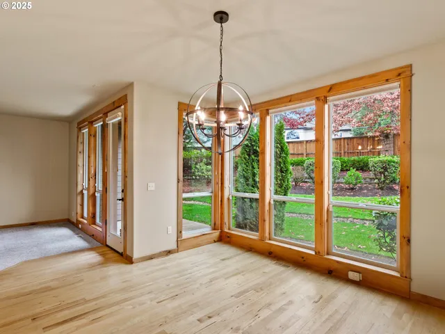 a kitchen with kitchen island granite countertop a sink cabinets and refrigerator
