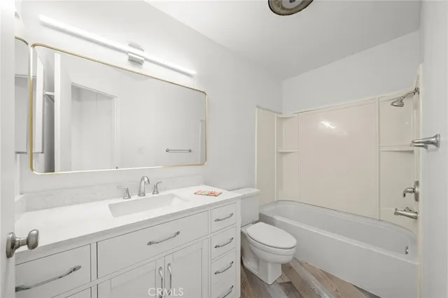 a bedroom with bed and window