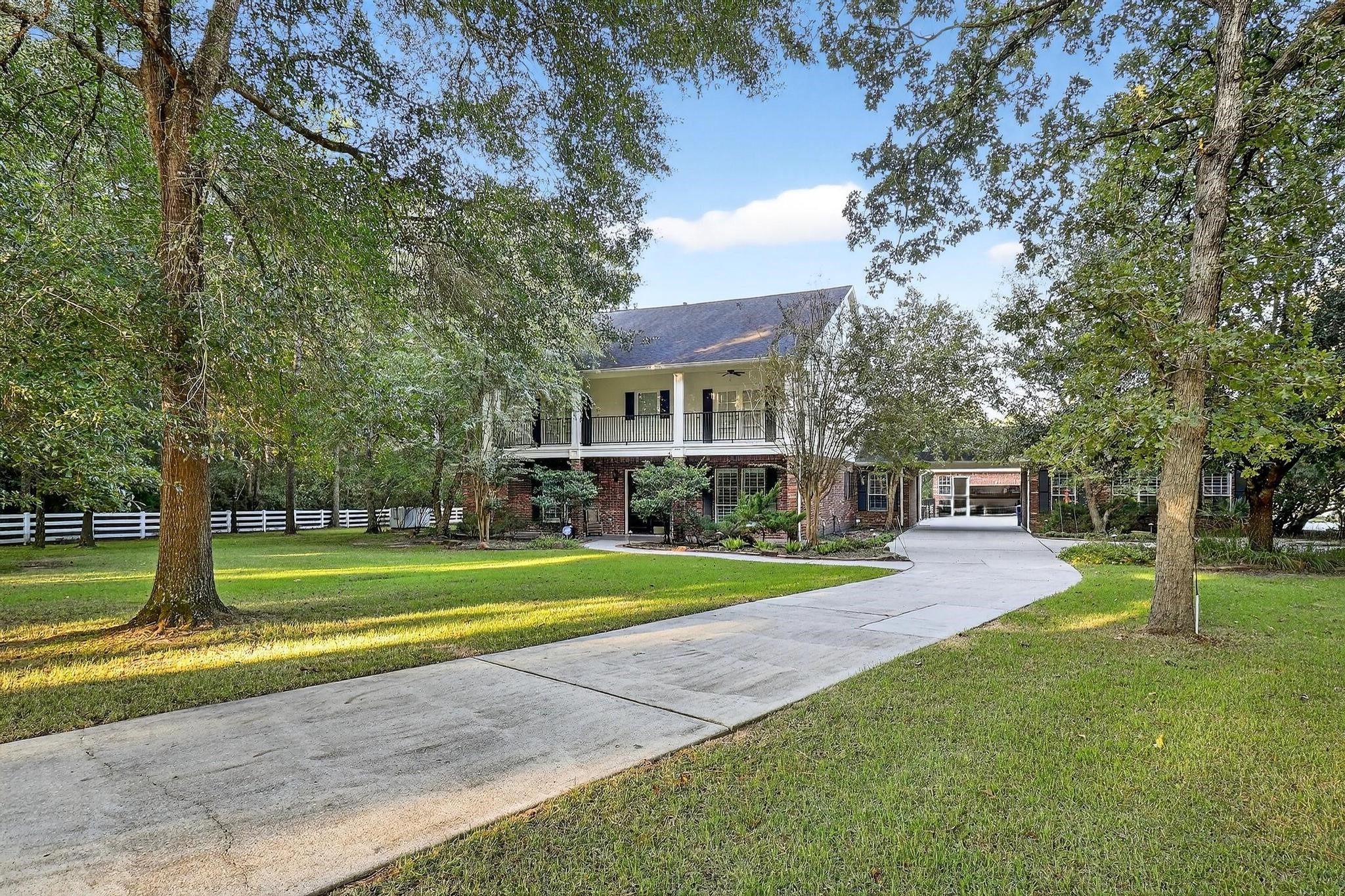 420 Whispering Meadow Magnolia, TX 77355 - Photo 2 of 44 a view of a park with large trees