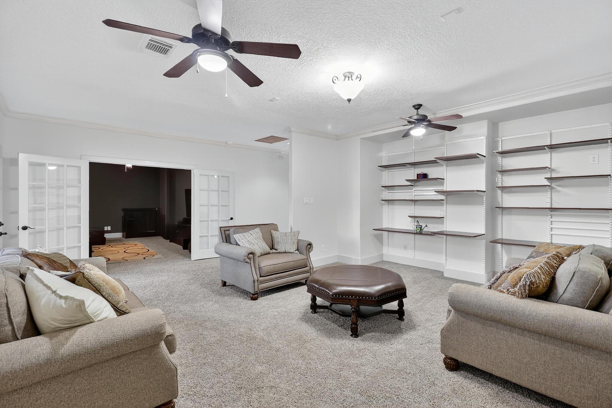 420 Whispering Meadow Magnolia, TX 77355 - Photo 23 of 44 a living room with furniture and a flat screen tv