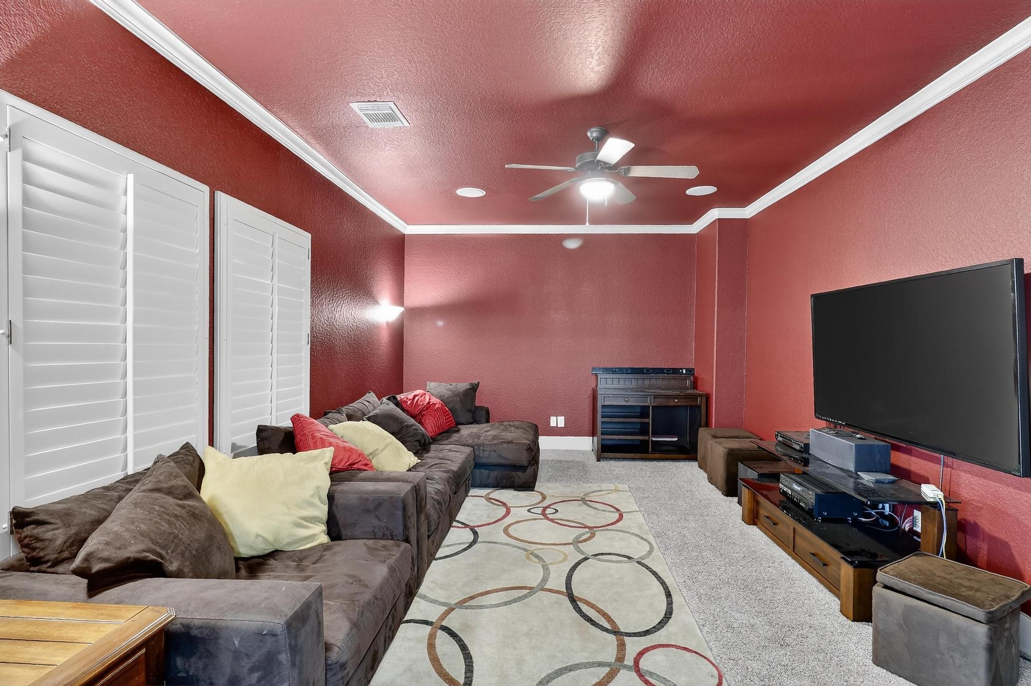 420 Whispering Meadow Magnolia, TX 77355 - Photo 31 of 44 a living room with furniture and a flat screen tv