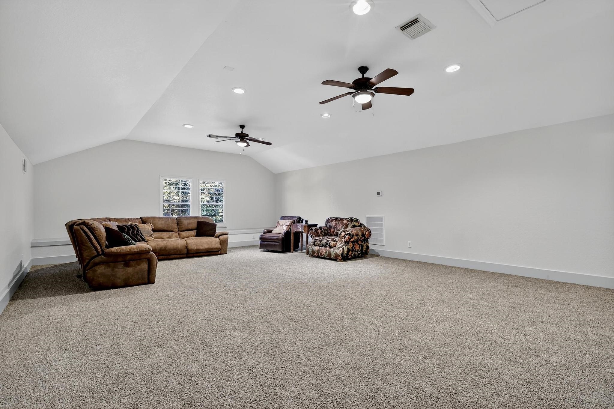 420 Whispering Meadow Magnolia, TX 77355 - Photo 32 of 44 a living room with furniture and a ceiling fan