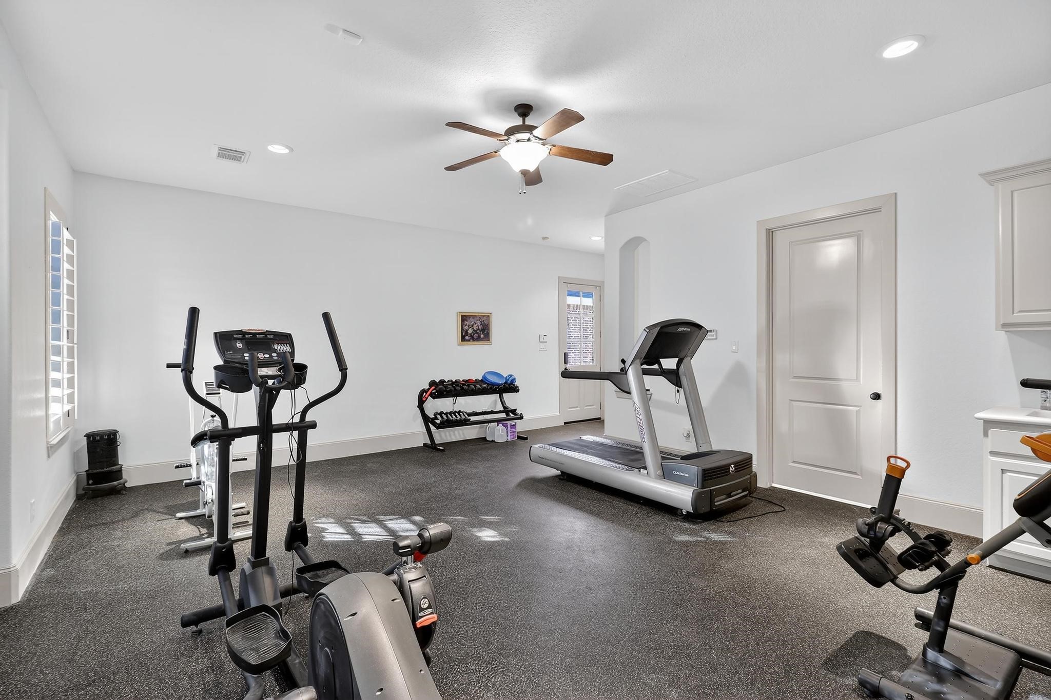 420 Whispering Meadow Magnolia, TX 77355 - Photo 34 of 44 a view of a room with gym equipment
