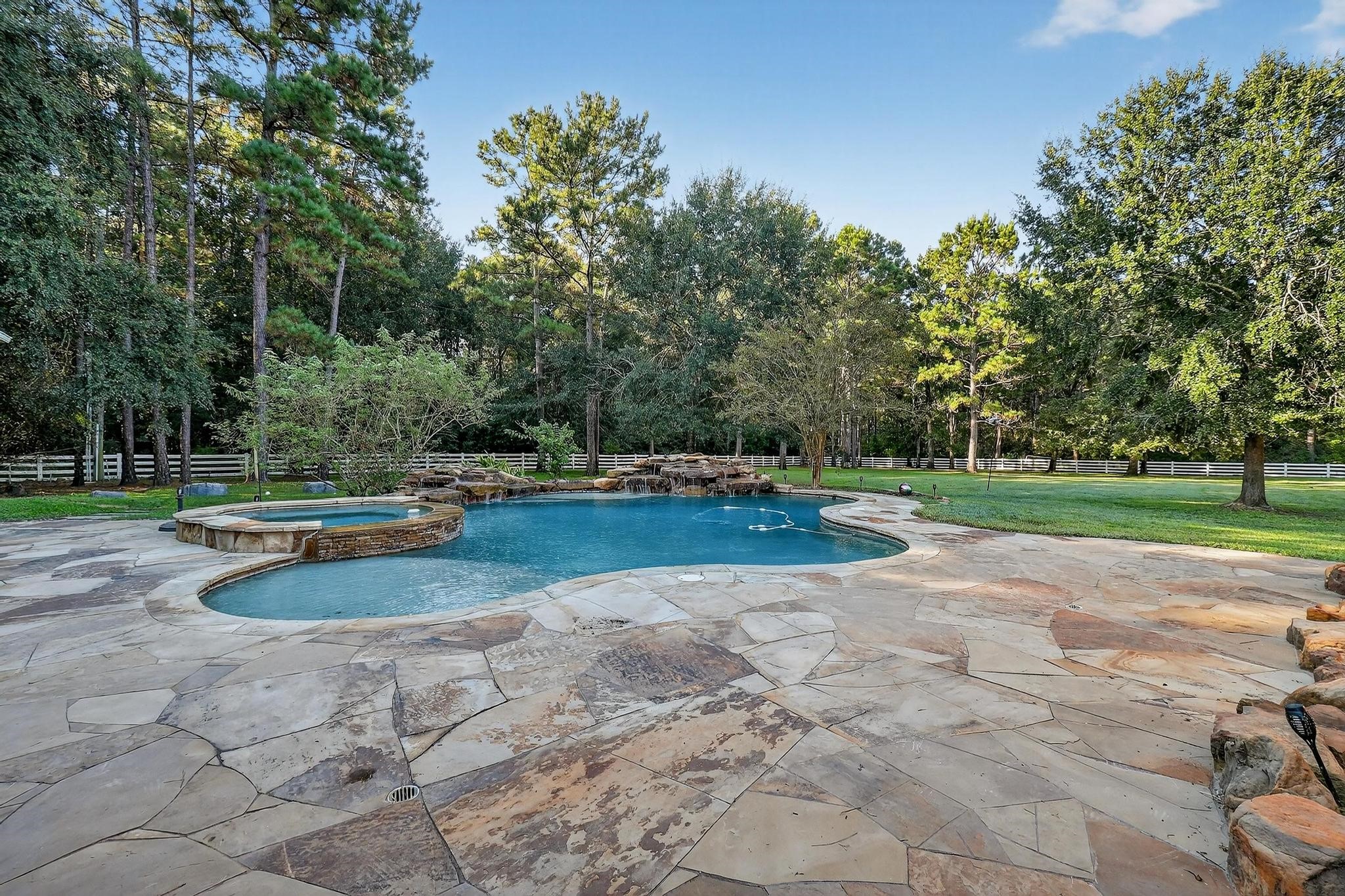 420 Whispering Meadow Magnolia, TX 77355 - Photo 37 of 44 a view of a fountain with large trees