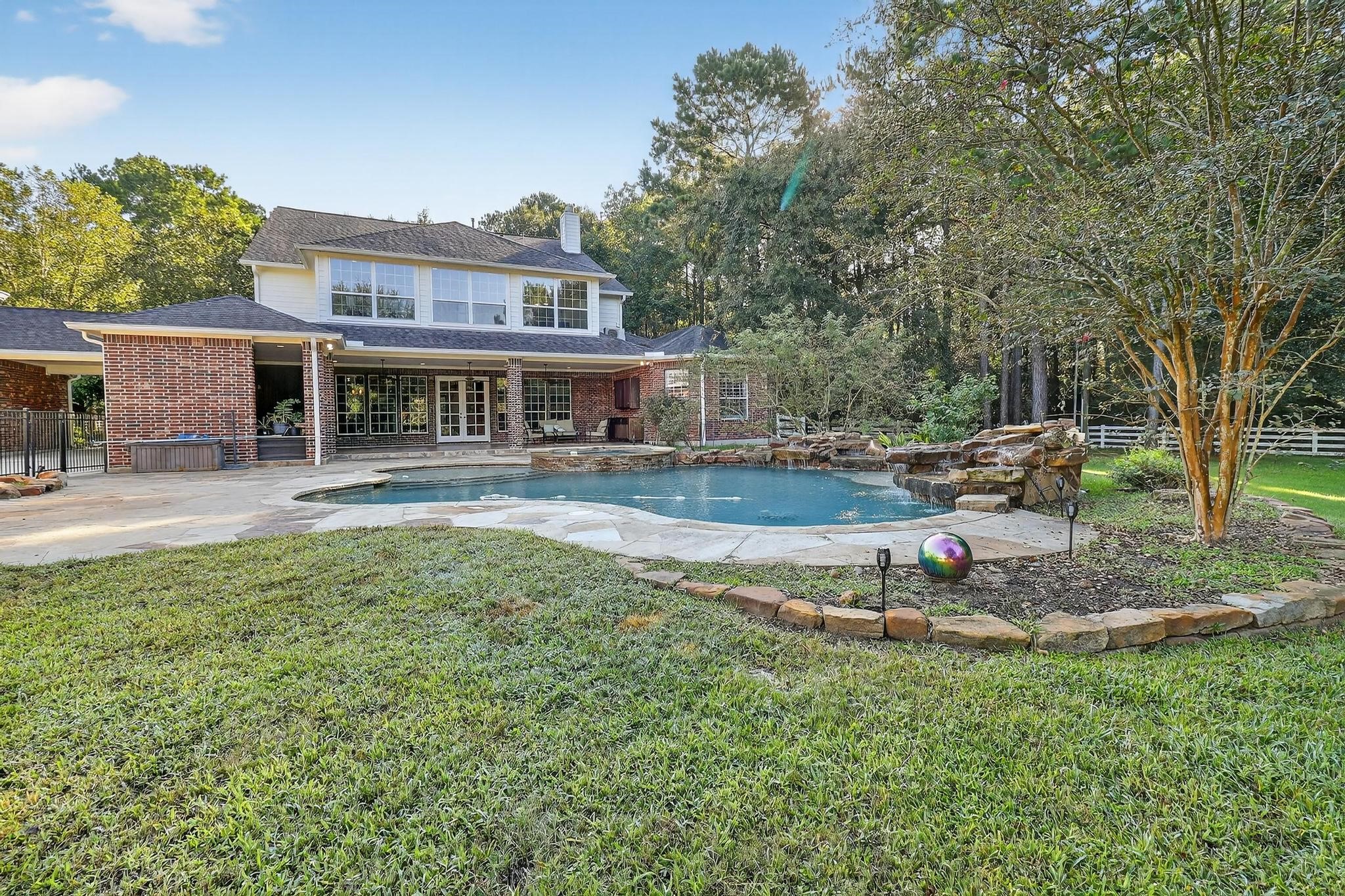 420 Whispering Meadow Magnolia, TX 77355 - Photo 41 of 44 a house view with swimming pool and sitting space