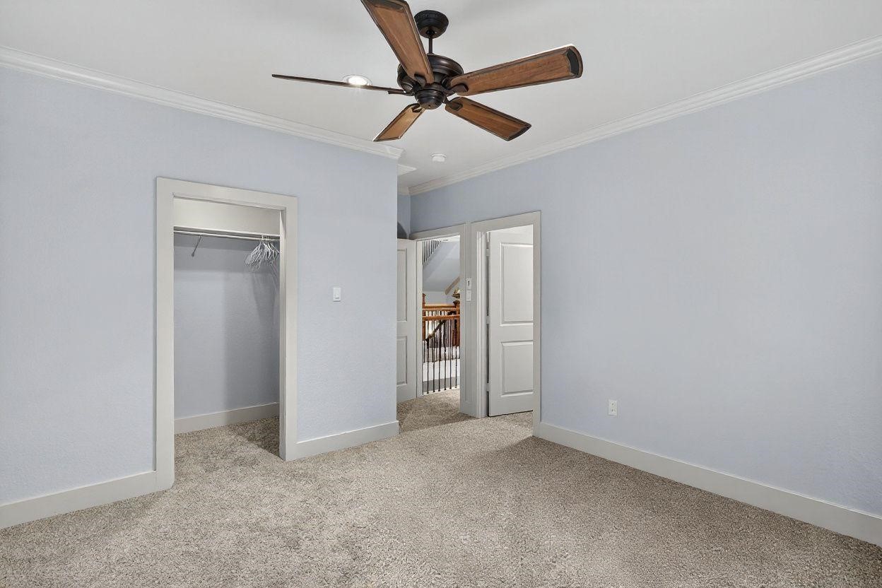 420 Whispering Meadow Magnolia, TX 77355 - Photo 9 of 44 a view of an empty room with a ceiling fan