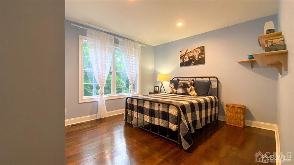 45 Stratton Road Old Bridge, NJ 07747 - Photo 11 of 19 a bed sitting in a spacious bedroom next to a window