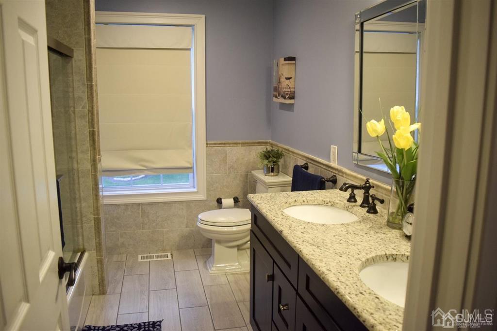 45 Stratton Road Old Bridge, NJ 07747 - Photo 12 of 19 a bathroom with a granite countertop sink toilet and shower