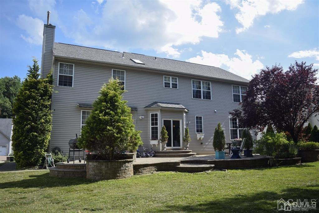 45 Stratton Road Old Bridge, NJ 07747 - Photo 18 of 19 a front view of a house with garden