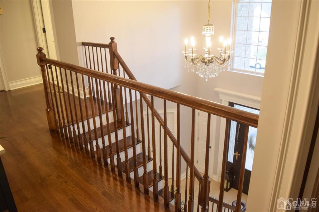 45 Stratton Road Old Bridge, NJ 07747 - Photo 8 of 19 a view of staircase with railing and a window