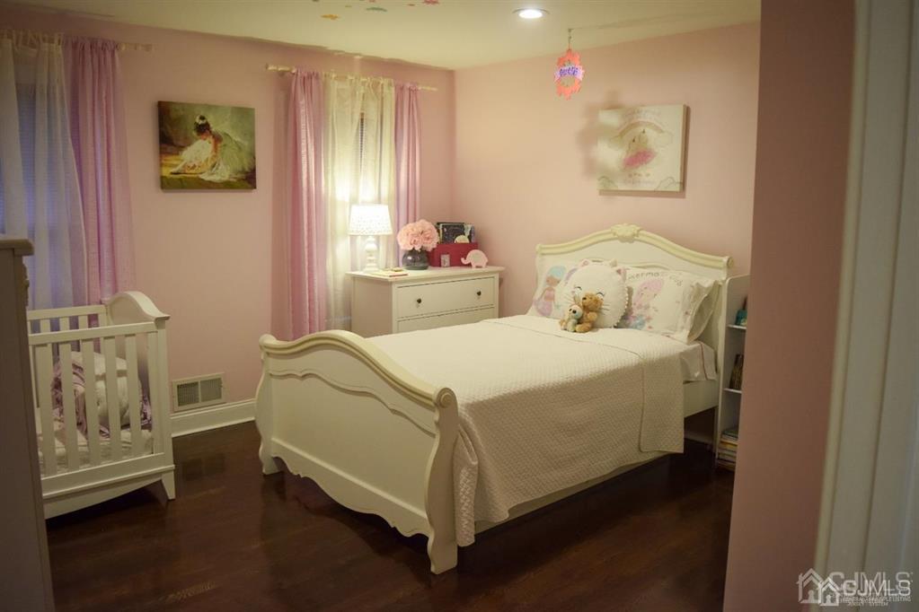 45 Stratton Road Old Bridge, NJ 07747 - Photo 9 of 19 a bedroom with a bed and a window