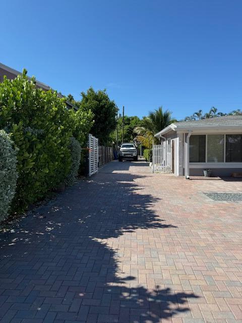 5409 Buchanan Road Delray Beach, FL 33484 - Photo 2 of 25 a front view of a house with a yard