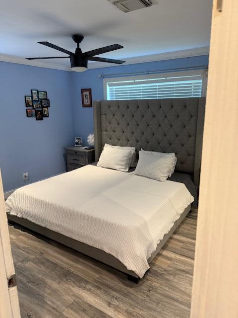 5409 Buchanan Road Delray Beach, FL 33484 - Photo 6 of 25 a bedroom with bed and wooden floor