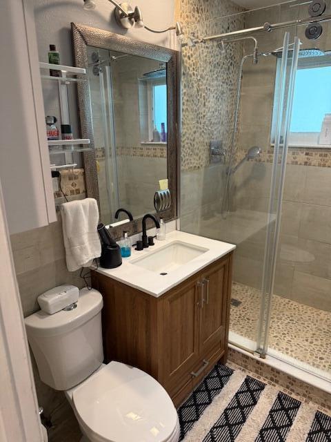 5409 Buchanan Road Delray Beach, FL 33484 - Photo 9 of 25 a bathroom with a sink toilet and shower