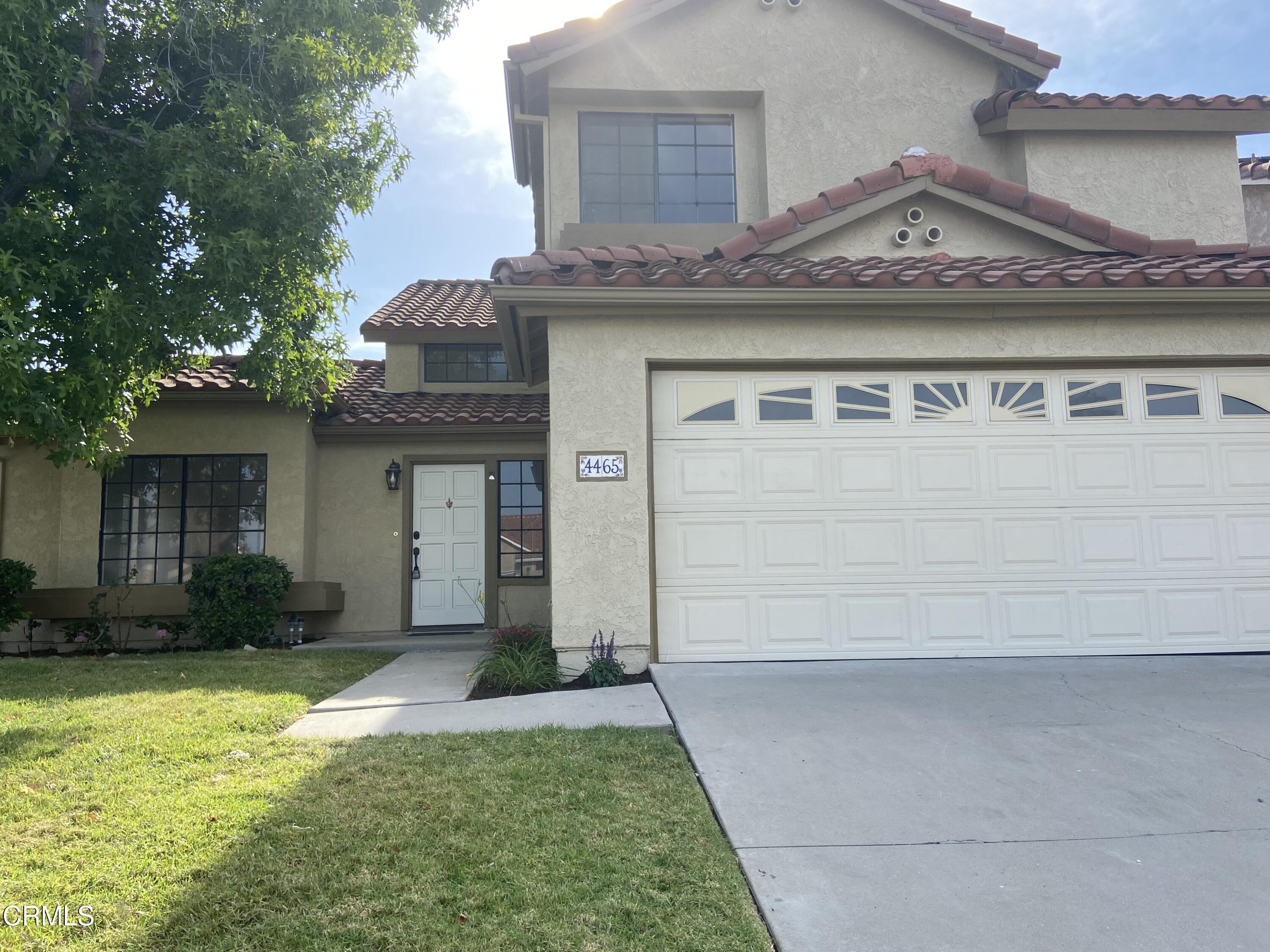 4465 Pine Ridge Court Moorpark, CA 93021 - Photo 2 of 22 a front view of a house with garden
