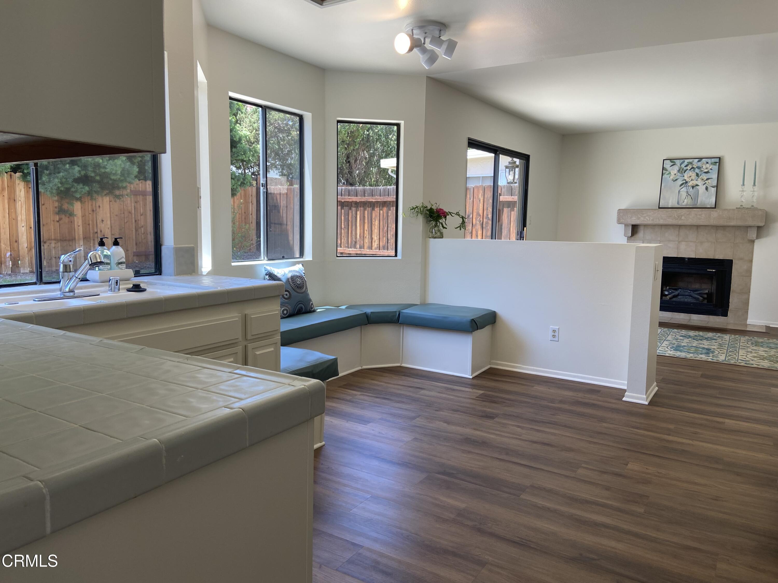 4465 Pine Ridge Court Moorpark, CA 93021 - Photo 18 of 22 a living room with fireplace furniture and a large window