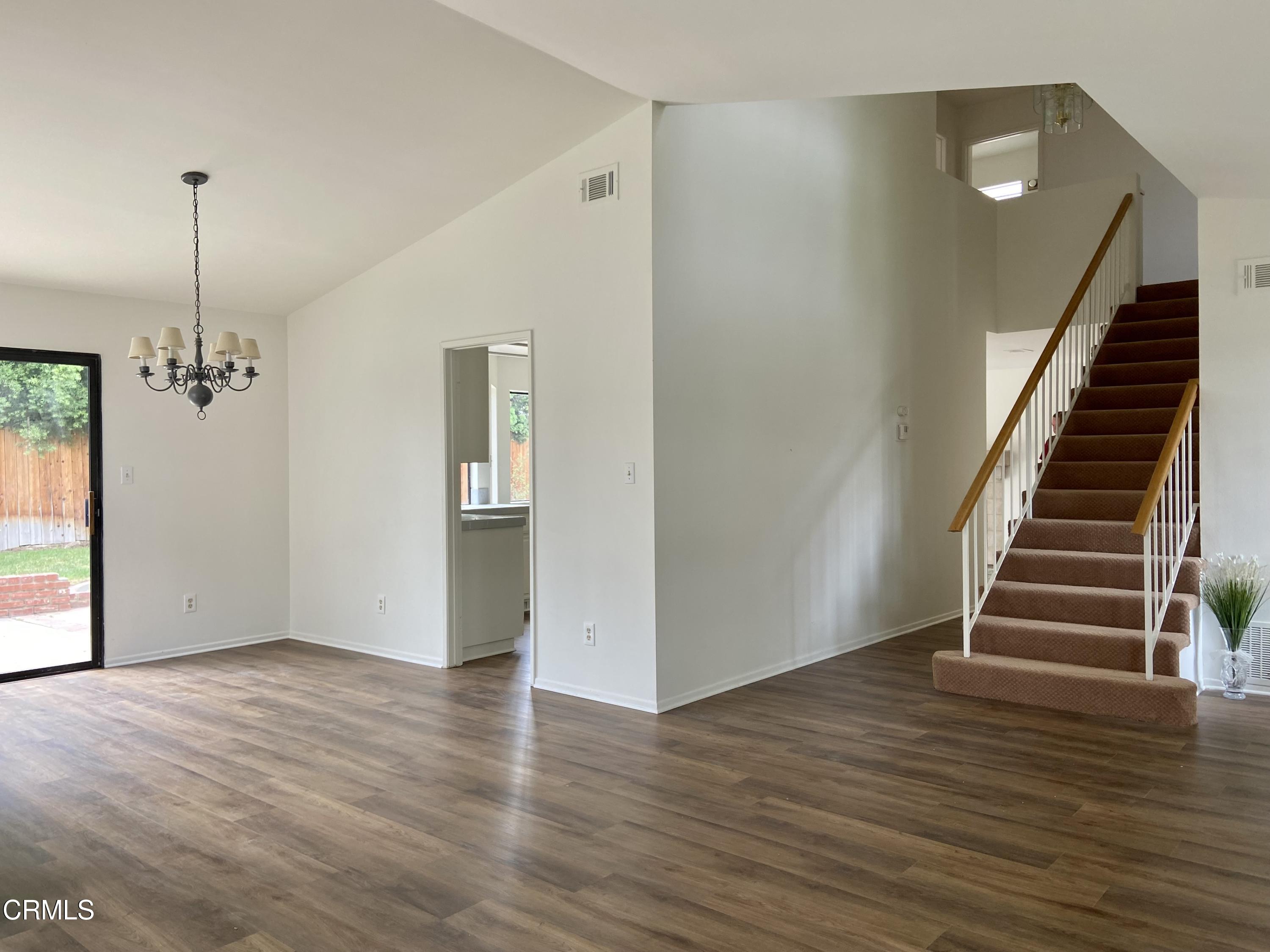 4465 Pine Ridge Court Moorpark, CA 93021 - Photo 4 of 22 a view of a room with wooden floor and stairs