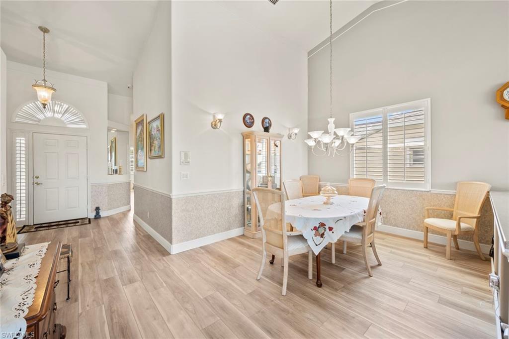 20810 Rivers Ford Estero, FL 33928 - Photo 11 of 49 a view of a dining room with furniture and wooden floor