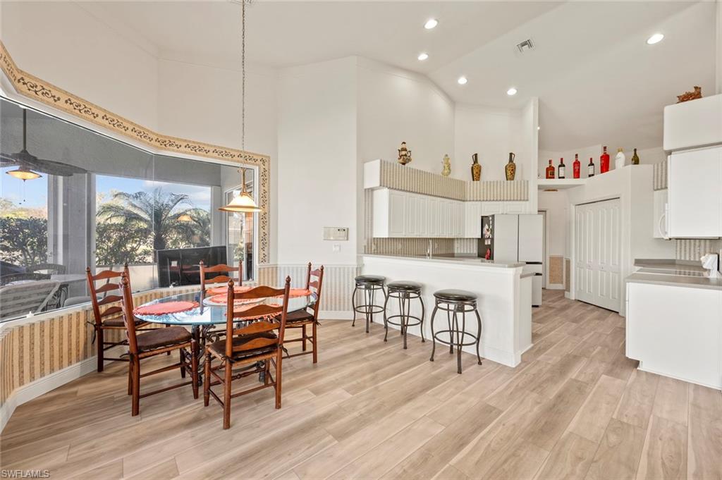 20810 Rivers Ford Estero, FL 33928 - Photo 19 of 49 a dining room with furniture window and wooden floor