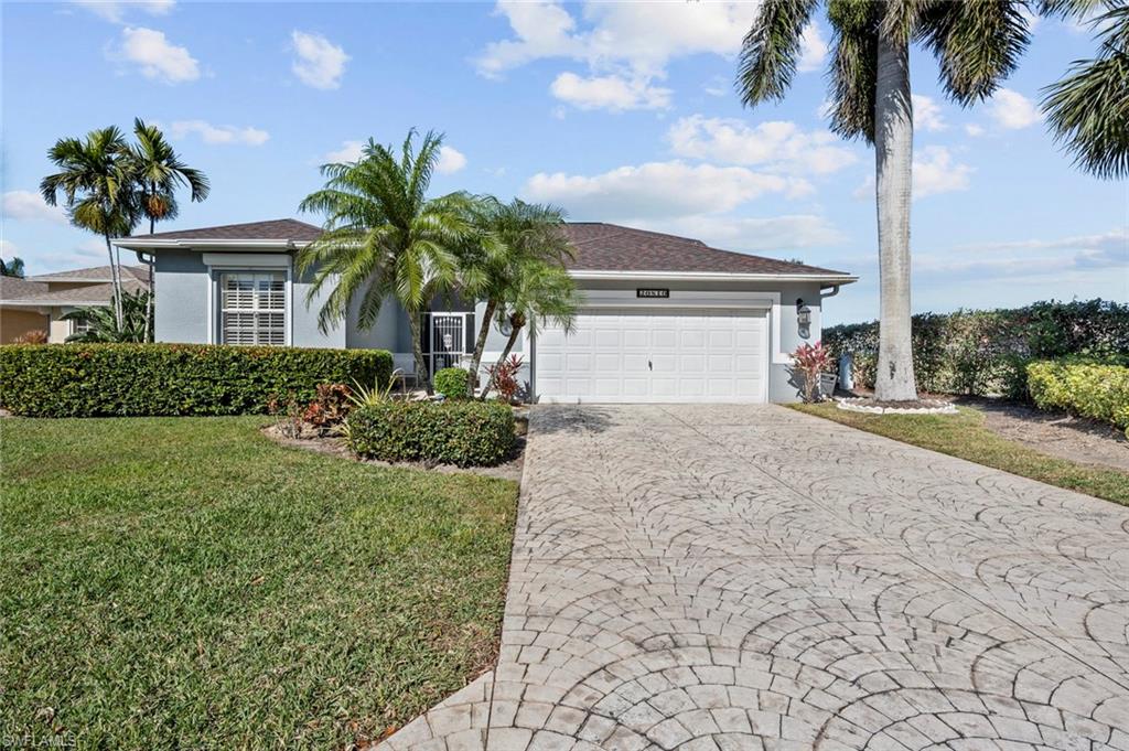 20810 Rivers Ford Estero, FL 33928 - Photo 2 of 49 a view of a house with a yard and palm trees