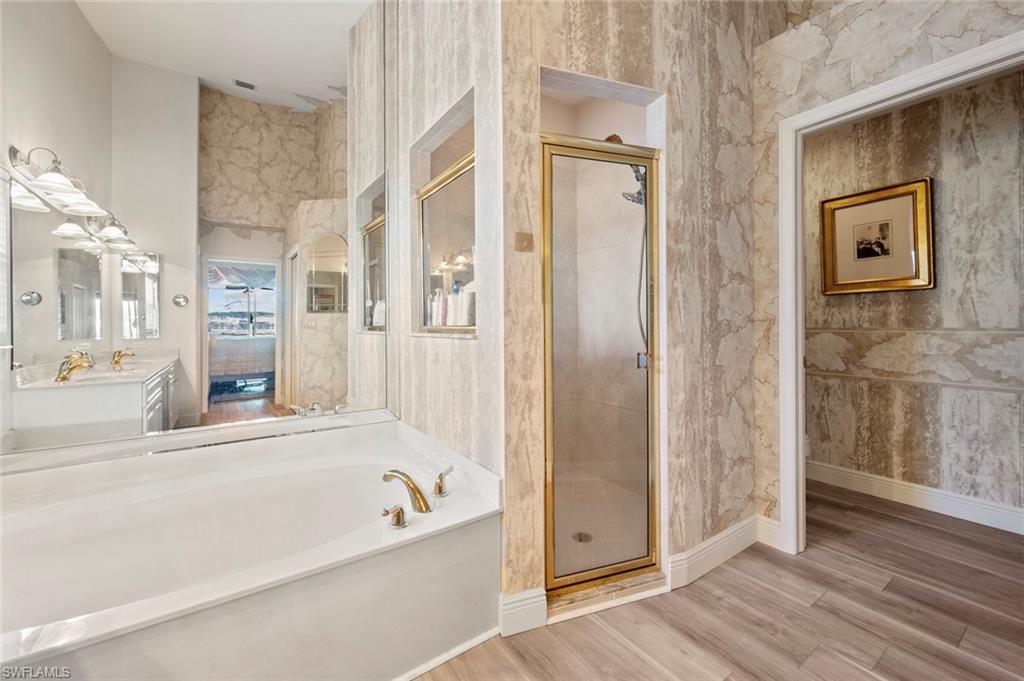 20810 Rivers Ford Estero, FL 33928 - Photo 28 of 49 a bathroom with a bathtub and a shower