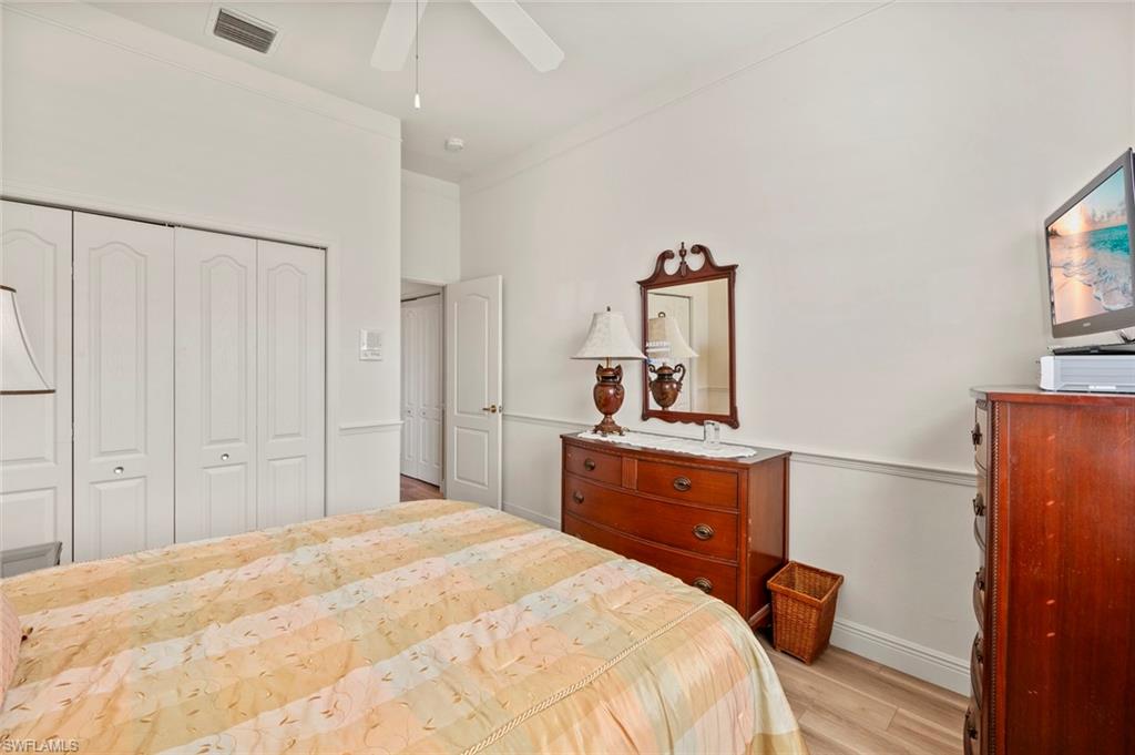 20810 Rivers Ford Estero, FL 33928 - Photo 30 of 49 a bedroom with a bed and a dresser
