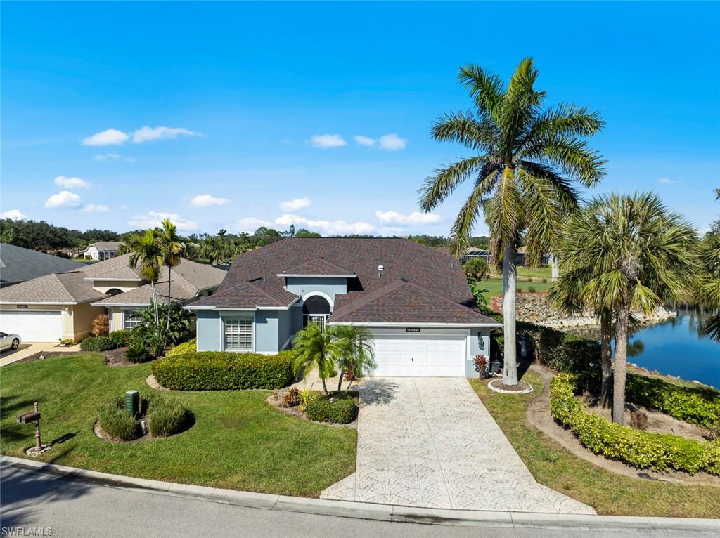 20810 Rivers Ford Estero, FL 33928 - Photo 3 of 49 front view of a house with a yard