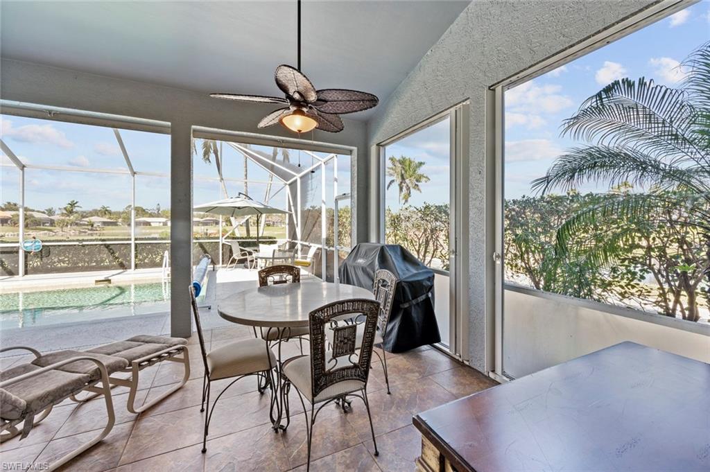 20810 Rivers Ford Estero, FL 33928 - Photo 37 of 49 a view of a dining room with furniture large windows and wooden floor