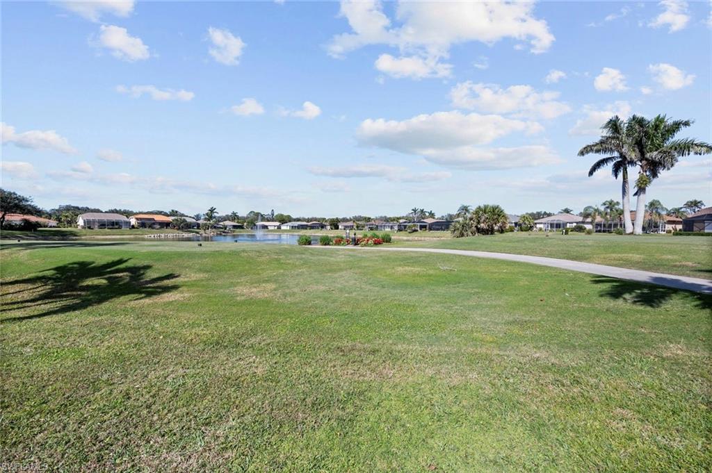 20810 Rivers Ford Estero, FL 33928 - Photo 42 of 49 a view of a golf course with a lake